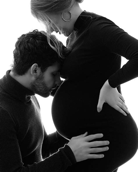 couple maternity pics|maternity photoshoot kissing belly.